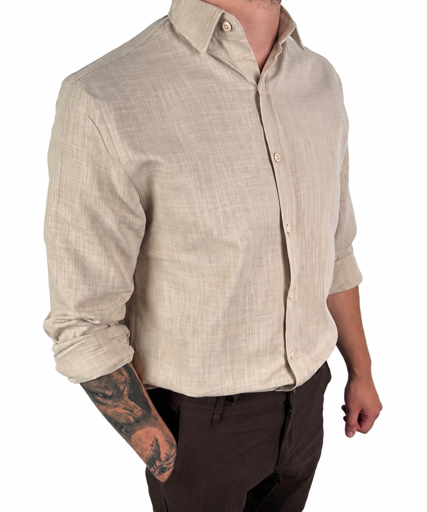 A man wearing a light beige linen button-down shirt with dark brown shorts, shown from the waist down against a plain white background.