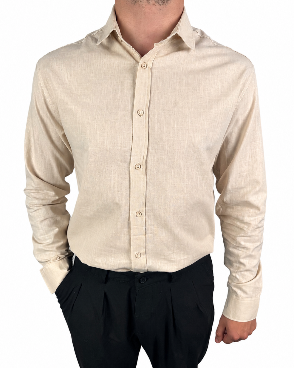 A man wearing a light beige linen long-sleeve button-down shirt and black trousers, shown from the neck down against a plain white background.