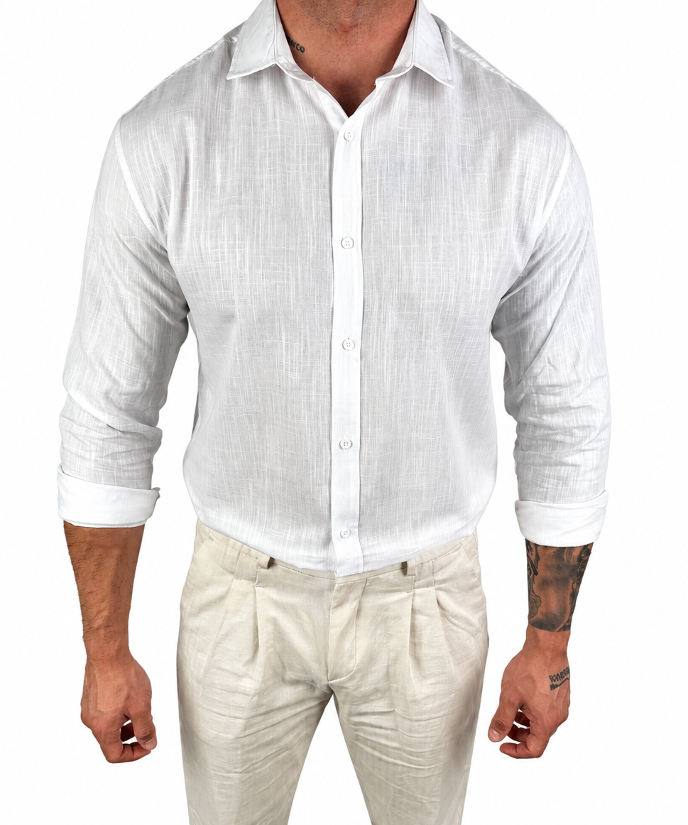 A man wearing a white long-sleeve linen button-up shirt and light beige linen trousers, shown from the neck down against a plain white background.