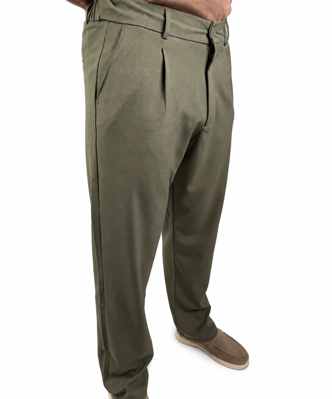 A person wearing olive green pleated trousers, shown from the waist down against a plain white background.