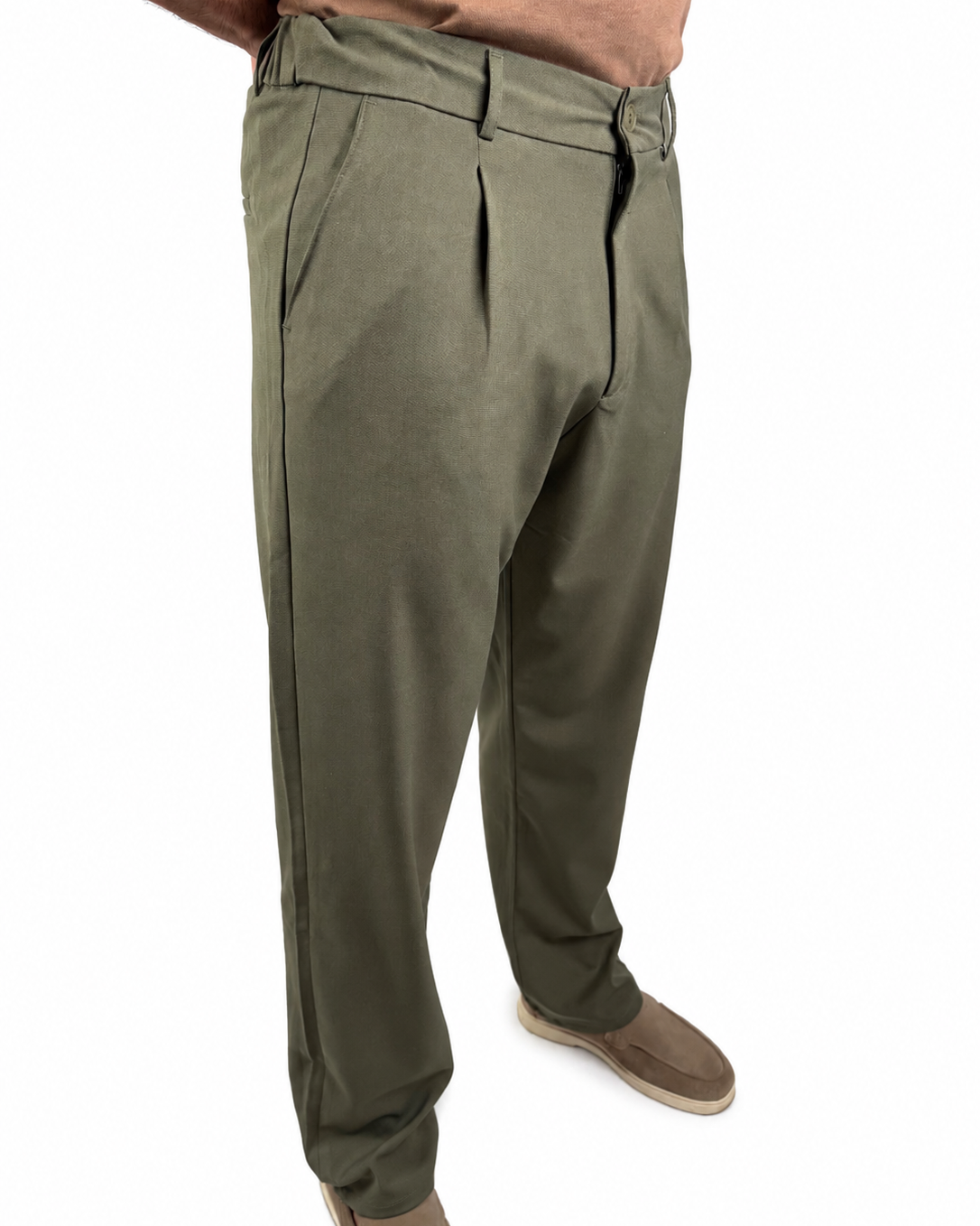 A person wearing olive green pleated trousers, shown from the waist down against a plain white background.