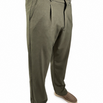 A person wearing olive green pleated trousers, shown from the waist down against a plain white background.