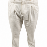 A person wearing light beige pleated trousers with a textured linen-like fabric, paired with brown shoes against a plain white background.