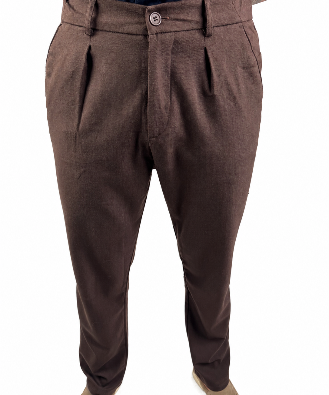 A pair of men's brown pleated trousers shown on a model from the waist down, paired with beige shoes against a plain white background.