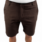 A person wearing dark brown chino shorts with a white t-shirt, cropped from the chest down, against a plain white background.