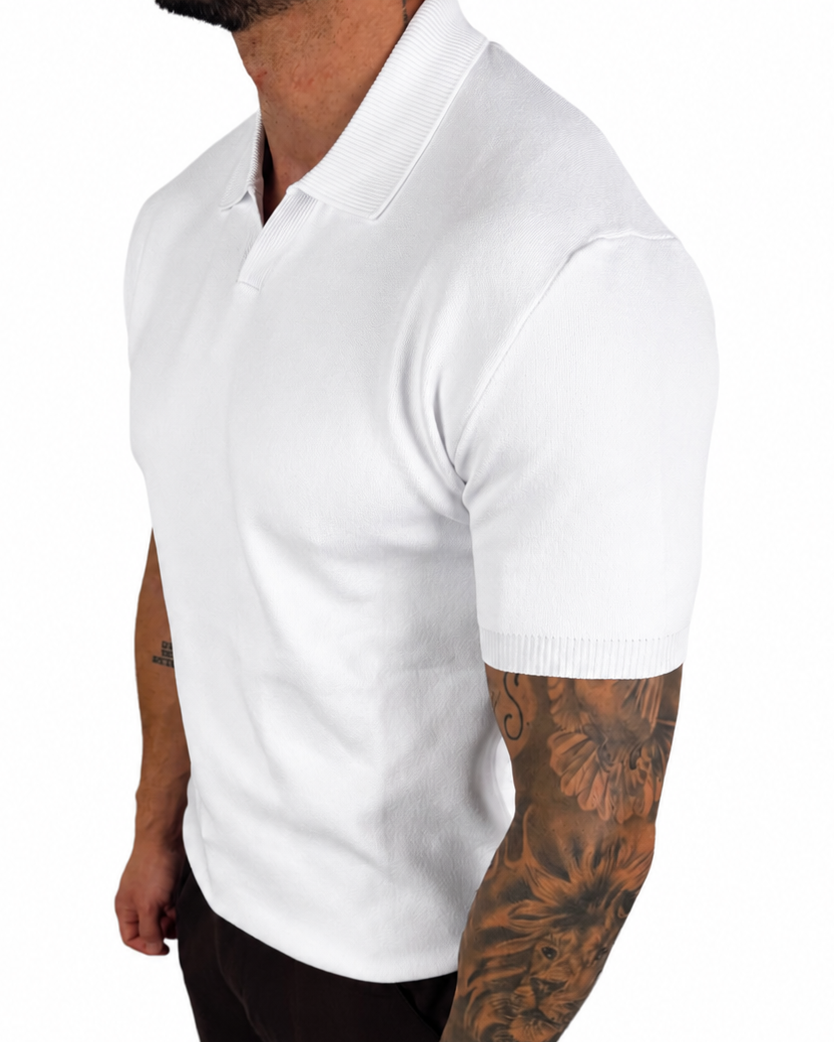 A man wearing a white short-sleeve polo shirt and black pants, shown from the side against a plain white background.